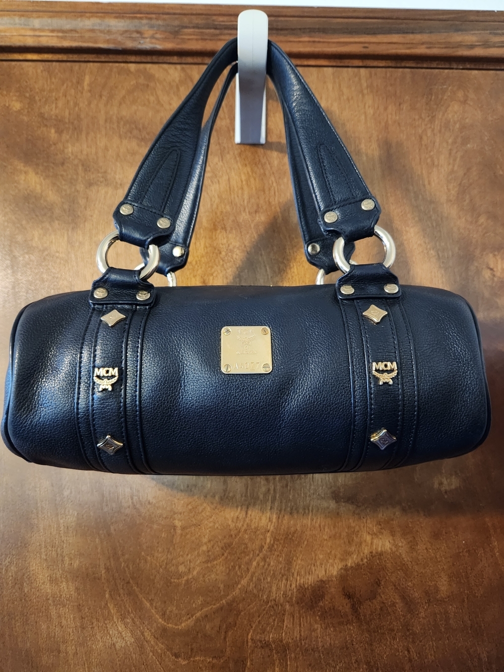 Authentic MCM Black Leather Barrel Bag with Gold Hardware